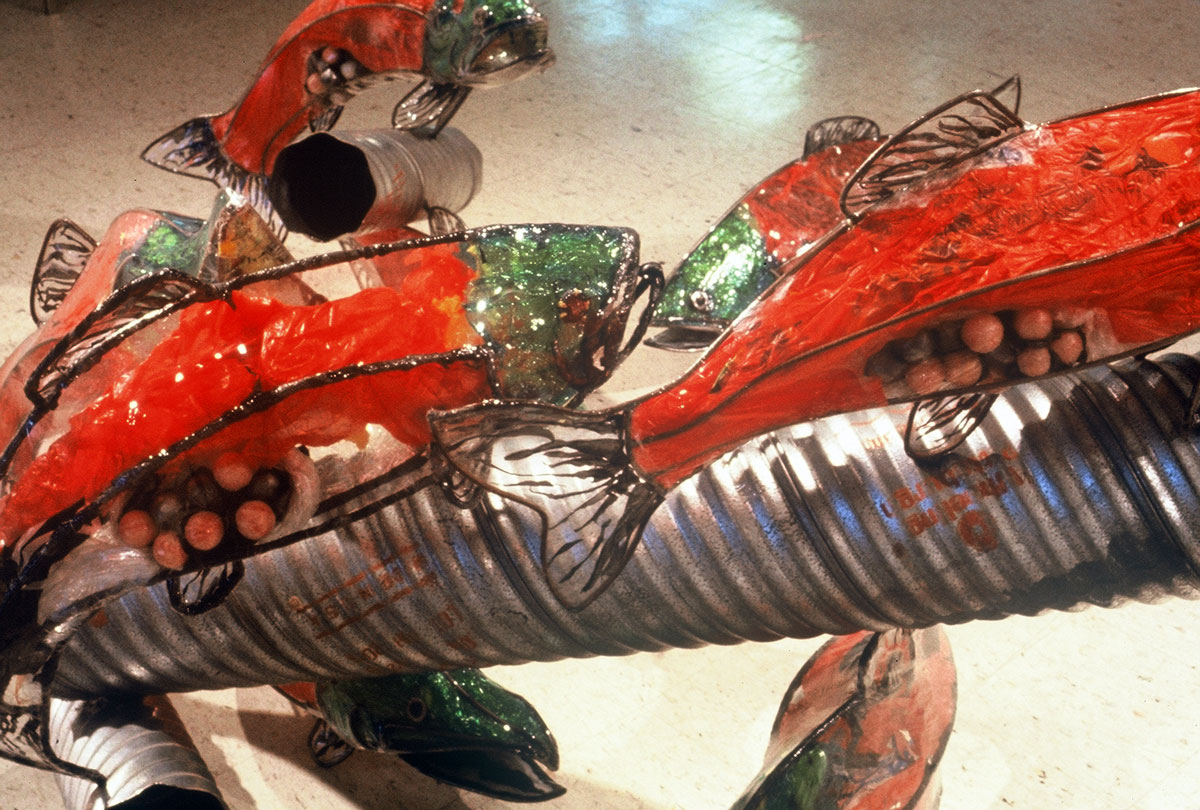 Sculpture installation of fish made of plastic bottles by Christy Rupp