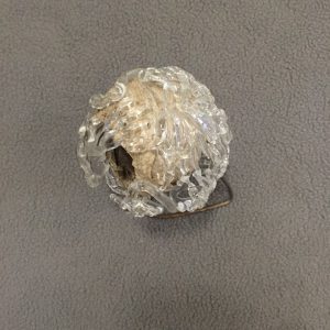 Wasp nest with glass hands (protecting things that may not be friendly to us), 4 x 4 x 5 inches, steel, wasp nest, flame worked glass